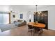Open concept living room and dining area featuring modern lighting and hardwood floors at 4600 N 68Th St # 370, Scottsdale, AZ 85251