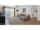 Comfortable living room featuring a sectional sofa, area rug, and hardwood floors at 4600 N 68Th St # 370, Scottsdale, AZ 85251