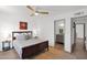 Comfortable primary bedroom with a wood bed frame, ceiling fan, and serene decor at 4600 N 68Th St # 370, Scottsdale, AZ 85251