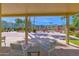 Relaxing outdoor patio seating area overlooking a community pool and well-maintained landscaping at 4600 N 68Th St # 370, Scottsdale, AZ 85251