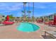 Community pool with lounge chairs and palm trees, perfect for relaxation at 4600 N 68Th St # 370, Scottsdale, AZ 85251
