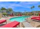 Resort-style pool area with ample seating and lush greenery, ideal for unwinding at 4600 N 68Th St # 370, Scottsdale, AZ 85251