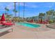 Relaxing community pool area with lounge chairs and palm trees, perfect for residents at 4600 N 68Th St # 370, Scottsdale, AZ 85251