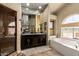 Bright bathroom featuring a tub, shower, and double vanity at 4727 E Rancho Caliente Dr, Cave Creek, AZ 85331
