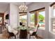 Cozy breakfast nook with pool view, a chandelier, and seating for four at 4727 E Rancho Caliente Dr, Cave Creek, AZ 85331