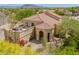 Stunning desert home with a tile roof, portico, and upper deck in a lush desert setting at 4727 E Rancho Caliente Dr, Cave Creek, AZ 85331