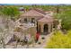 Desert home with covered entry, upper deck, mature desert plants, and mountain views at 4727 E Rancho Caliente Dr, Cave Creek, AZ 85331