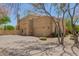 Spacious home with a three-car garage, a chimney, and stucco facade surrounded by desert landscaping at 4727 E Rancho Caliente Dr, Cave Creek, AZ 85331