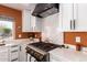 Gourmet kitchen featuring white cabinetry, quartz countertops, and a black gas range at 4727 E Rancho Caliente Dr, Cave Creek, AZ 85331