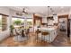 Bright kitchen with breakfast nook, quartz countertops, and island seating at 4727 E Rancho Caliente Dr, Cave Creek, AZ 85331