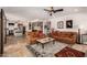 Open living room with tile floors, ceiling fan, and easy access to the kitchen at 4727 E Rancho Caliente Dr, Cave Creek, AZ 85331