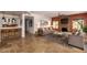 Well-lit living room with bar, tile floors, stone fireplace, and comfortable seating at 4727 E Rancho Caliente Dr, Cave Creek, AZ 85331