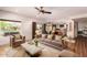 Bright living room with modern furnishings, tile flooring, and an open floor plan at 4727 E Rancho Caliente Dr, Cave Creek, AZ 85331