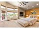 Bright main bedroom featuring large windows, neutral tones, and contemporary furniture at 4727 E Rancho Caliente Dr, Cave Creek, AZ 85331