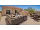 Wide rooftop deck featuring outdoor seating areas and desert views under a clear blue sky at 4727 E Rancho Caliente Dr, Cave Creek, AZ 85331