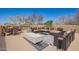 Outdoor living space featuring multiple seating areas on a rooftop deck with blue sky in the background at 4727 E Rancho Caliente Dr, Cave Creek, AZ 85331