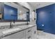 Bright bathroom with a double sink vanity, granite countertop, and updated fixtures at 4732 S 38Th Gln, Phoenix, AZ 85041