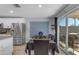 Cozy dining area with a stainless steel refrigerator and sliding glass doors to the outdoor patio at 4732 S 38Th Gln, Phoenix, AZ 85041
