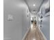 Bright hallway featuring light wood floors, neutral walls, and recessed lighting throughout at 4732 S 38Th Gln, Phoenix, AZ 85041