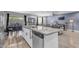Open-concept kitchen with stainless steel dishwasher and a view into the living and dining areas at 4732 S 38Th Gln, Phoenix, AZ 85041