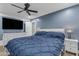 Bedroom features a modern ceiling fan and contemporary decor at 4732 S 38Th Gln, Phoenix, AZ 85041