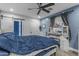 Bedroom features a modern ceiling fan and an en-suite bathroom with barn door at 4732 S 38Th Gln, Phoenix, AZ 85041