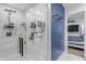 Modern shower featuring marble-like tile and updated fixtures at 4732 S 38Th Gln, Phoenix, AZ 85041