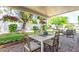 Relaxing covered patio with outdoor dining area, perfect for entertaining in the landscaped backyard at 4950 N 78Th St, Scottsdale, AZ 85251