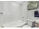 Clean, well-lit bathroom featuring white tile and modern fixtures, for a comfortable experience at 4950 N 78Th St, Scottsdale, AZ 85251
