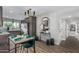 Stylish dining area featuring modern lighting, seating, and decor leading to the kitchen at 4950 N 78Th St, Scottsdale, AZ 85251