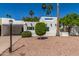 Charming home showcasing desert landscaping with palm trees and a light-colored facade at 4950 N 78Th St, Scottsdale, AZ 85251