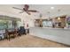 Functional community kitchen with ample counter space, modern appliances, and a cozy dining area at 4950 N 78Th St, Scottsdale, AZ 85251
