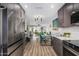 Spacious kitchen flows into the dining area with stainless steel appliances and modern decor at 4950 N 78Th St, Scottsdale, AZ 85251