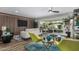 Bright and airy living room with modern furnishings, wood floors, and seamless indoor-outdoor flow at 4950 N 78Th St, Scottsdale, AZ 85251