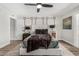 Comfortable main bedroom with neutral tones, stylish decor, and modern ceiling fan fixture at 4950 N 78Th St, Scottsdale, AZ 85251