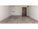Large parking area with an entryway featuring a decorative front door and white walls at 4950 N 78Th St, Scottsdale, AZ 85251