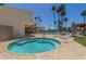 Relaxing hot tub and community pool surrounded by lounge areas and shaded tables for a resort-style experience at 4950 N 78Th St, Scottsdale, AZ 85251