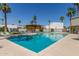 Inviting community swimming pool with ample lounge chairs and shade structures, perfect for relaxation and enjoyment at 4950 N 78Th St, Scottsdale, AZ 85251