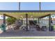 Community recreation area with covered picnic tables, basketball hoop, and outdoor games at 4950 N 78Th St, Scottsdale, AZ 85251