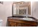 Bathroom featuring a vanity with a mirror and sink, and a tile shower at 501 E Hill Dr, Avondale, AZ 85323