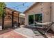 Outdoor brick patio featuring a grill, and a hammock overlooking the yard at 51 N Rush St, Chandler, AZ 85226