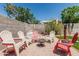 Cozy backyard seating area with Adirondack chairs around a fire pit at 51 N Rush St, Chandler, AZ 85226