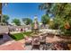Inviting backyard featuring an outdoor seating area, lawn, and gravel at 51 N Rush St, Chandler, AZ 85226