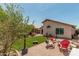 Backyard with grass and gravel sections, patio, and outdoor seating arrangement at 51 N Rush St, Chandler, AZ 85226