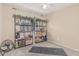 Neutral bedroom with two black metal shelves and a grey yoga mat on carpet at 51 N Rush St, Chandler, AZ 85226