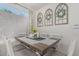 Elegant dining room with a rustic wood table, decorative wreaths, and a cozy atmosphere at 51 N Rush St, Chandler, AZ 85226