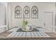Dining room features a rustic wood table, decorative floral wreaths, and inviting natural light at 51 N Rush St, Chandler, AZ 85226