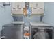 Bright laundry room with front loading washer, dryer, and shelving at 51 N Rush St, Chandler, AZ 85226