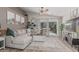 Open living room featuring a comfortable sectional sofa and sliding glass doors to the backyard at 51 N Rush St, Chandler, AZ 85226