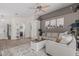 Bright living room with a cozy sectional sofa, ceiling fan, and stylish decor at 51 N Rush St, Chandler, AZ 85226